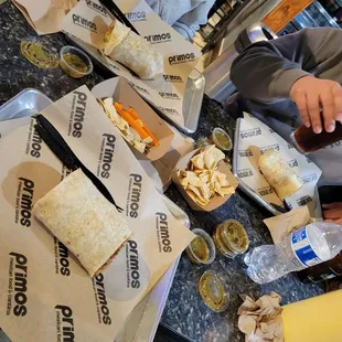 a table full of burritos