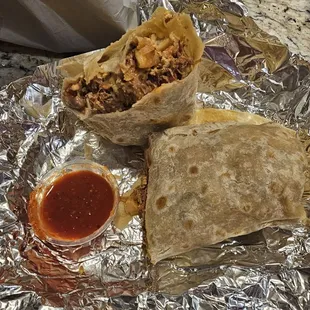 Machaca Breakfast Burrito: machaca (shredded beef), eggs, beans, potatoes, cheese, pico de gallo.