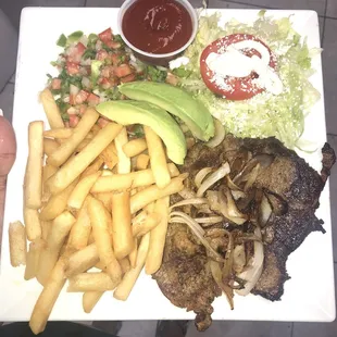 Carne asada (sub rice with fries) picó de gallo, avocado and fresh salad