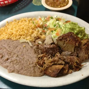 Carnitas with rice, beans, pico de gallo, and guacamole from Los Ramirez Mexican Restaurant.