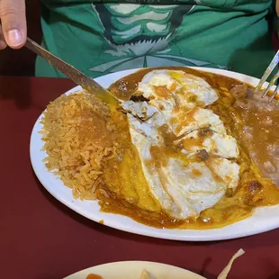 The Gavino special( enchiladas topped with eggs over medium