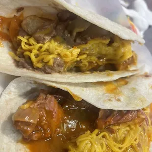 Carne Guisada with cheese and bacon potato bean and cheese tacos