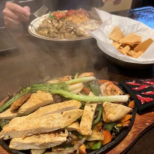 Chicken and shrimp fajitas and chilli verdes