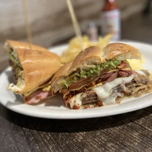 Del Rey Torta ($12) - Ham, mozzarella, pork sirloin, breaded beef, sausage-chorizo omelet, tomato, caramelized onions, avocado