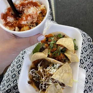 a person holding a bowl of food