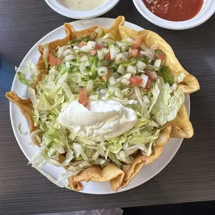 Lunch taco salad with steak and chicken