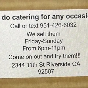 a hand holding a business card