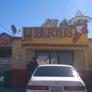 The outside from the dirt parking lot