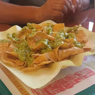 Guacamole on top of homemade chips
