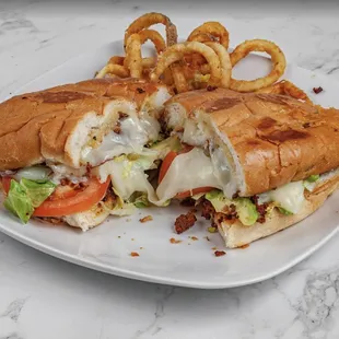 a sandwich with onion rings