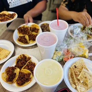 Tacos pastor, agua fresca pineapple and watermelon and cheese quesadillas