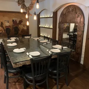 Large table for family, friends, and business. Semi private space.