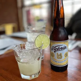 a beer and a glass on a table