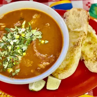 a bowl of soup and bread