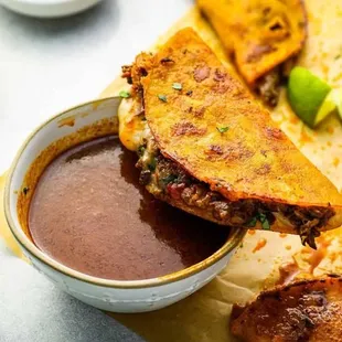 This matches their description of the tacos. "Two beef, chicken or potato filled in a corn tortilla and fried topped with lettuce and chees"