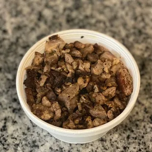 $3.50 Packed 8oz cup of carne asada for my and my sons enchiladas i like it on top ;)