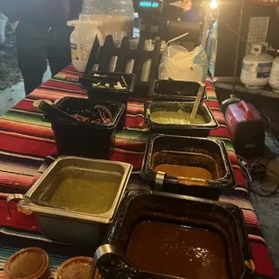 Green sauce furthest away is most mild, middle is smoky chipotle sauce, the closest is is red chili forward sauce