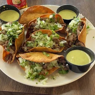 Tacos envenenados comes with chorizo potatos cheese choice of meet onion and cilantro