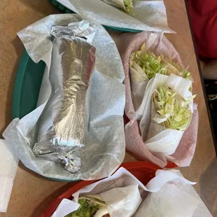 a burrito, a burrito, and a salad