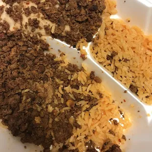 Chorizo and I think thats rice, oh wait... that is a SPOON of rice. Smh. $11 not worth it!