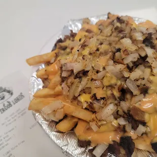 Animal style Carne Asada fries , the meat was seasoned really good and just satisfied my munchies