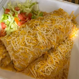 two enchillas in a styrofoam container