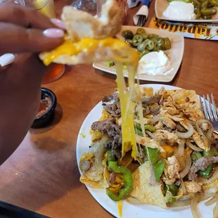 Beef &amp; chicken nachos look at that cheese pull