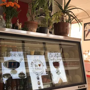 a display case with a variety of drinks