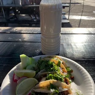 a plate of food and a bottle of water