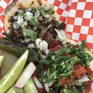 Volcanes (basically tacos with a layer of melted cheese under the meat which is, like, perfect) de asada y chorizo.