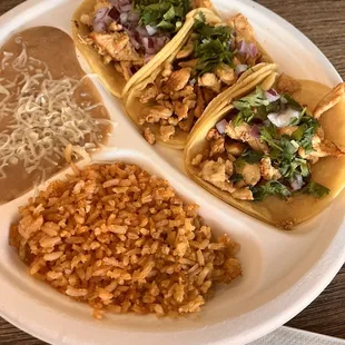 Chicken tacos with rice and beans