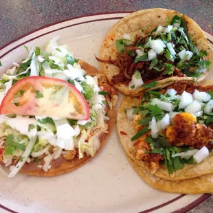 Chicken tostada, chorizo con huevos taco and barbecoa taco