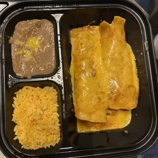 Beans Mexican rice and chicken enchilada