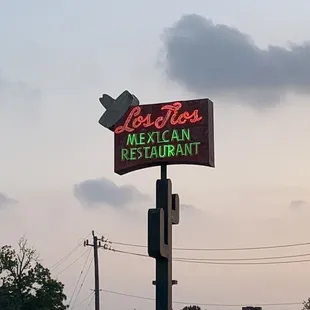 a neon sign for a mexican restaurant