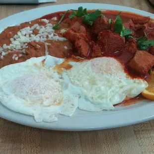 Asado de puerco with eggs and beans.