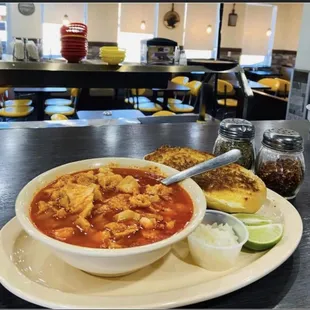 a bowl of chili and bread