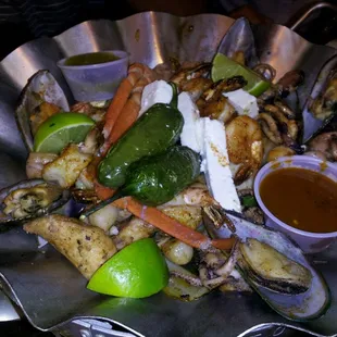 a plate of seafood and vegetables