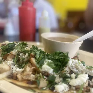 Chicken street tacos, cilantro, onion, avocado, lime &amp; beans