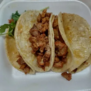 Orden de tacos Al Pastor (Order includes 4 tacos).
