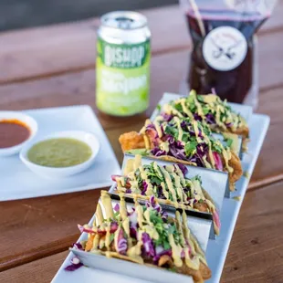 a plate of nachos and a cup of salsa