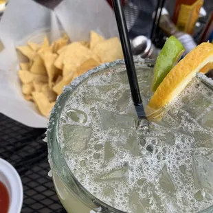 Happy hour margarita, chips and salsa