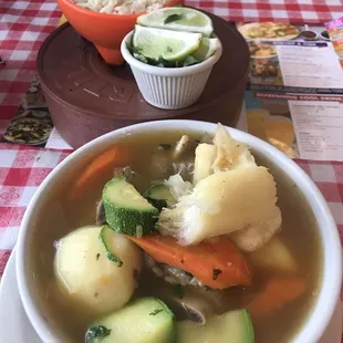 a bowl of soup and a bowl of rice