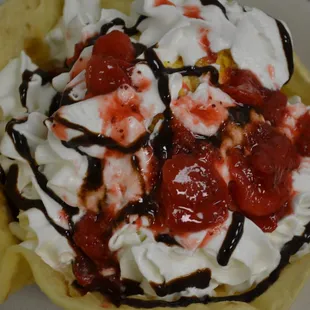 a bowl of ice cream and strawberries