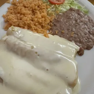 Cheese enchiladas with cheese sauce