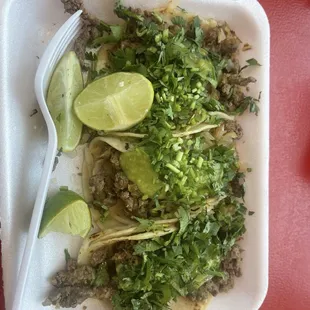 Order of 3 street tacos de carne asada, with cilantro, green salsa &amp; cebolla asada.