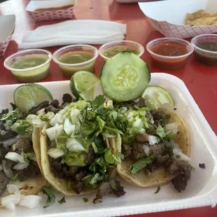 Carne asada street tacos and the selection of salsas