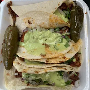 Cuatro adobada tacos. Each taco is almost as big as my face! Too much food!!