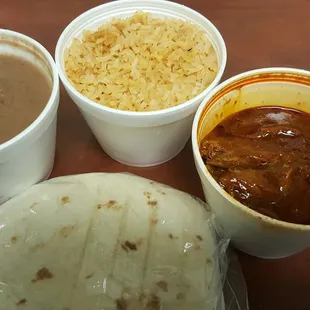 Mole with rice and beans. You can get corn tortillas or purchase homemade tortillas.