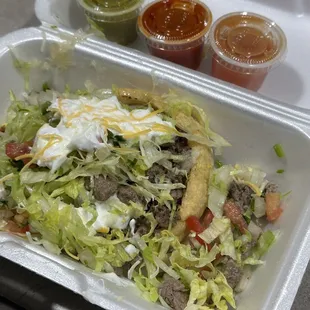 a salad in a styrofoam container