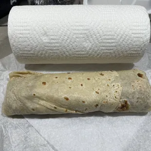 a burrito and a roll of toilet paper